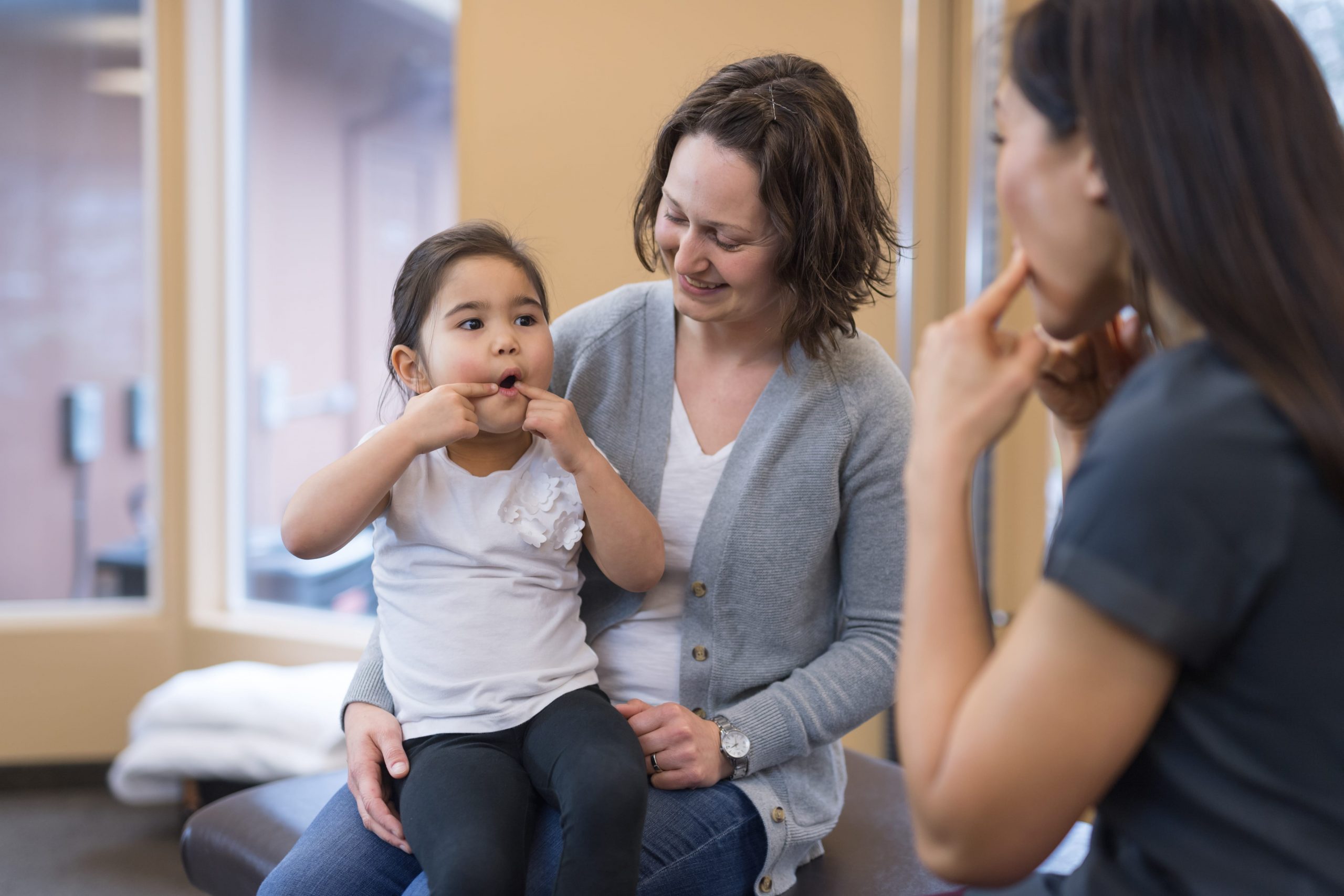 Girl in Speech Therapy with Mom