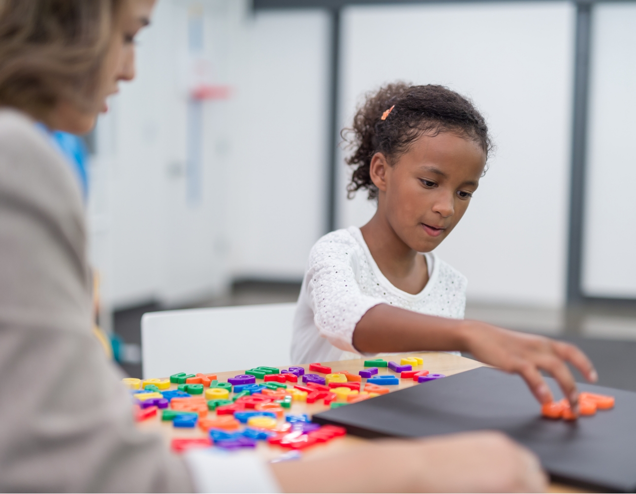 child playing with letter blocks