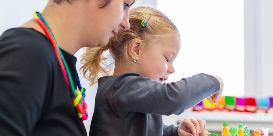 Children's occupational therapist with child patient