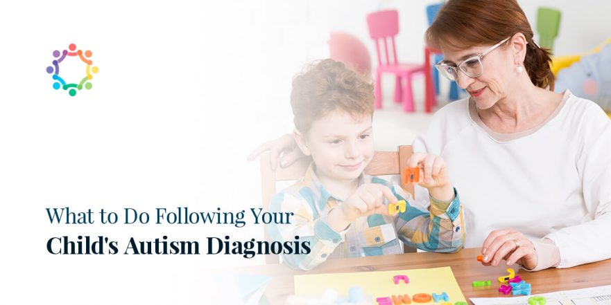 Adult with autistic child playing with letters