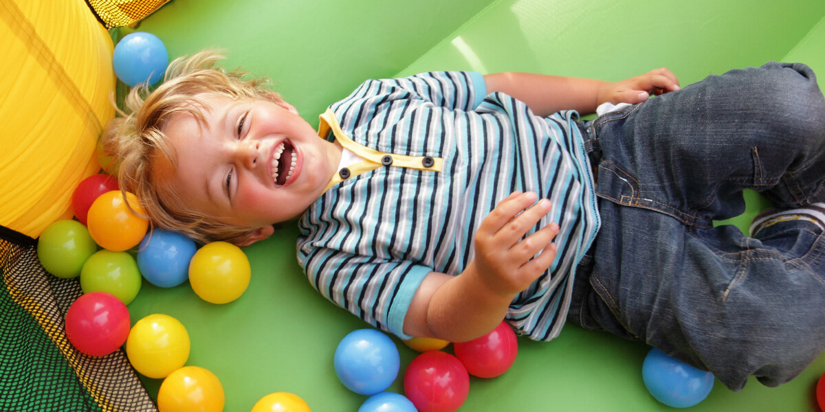 Child laughing in bouncy house